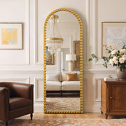 Delphine antique gold beaded arched full-length mirror in a living room