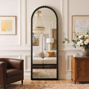 Delphine black beaded arched full-length mirror in a living room