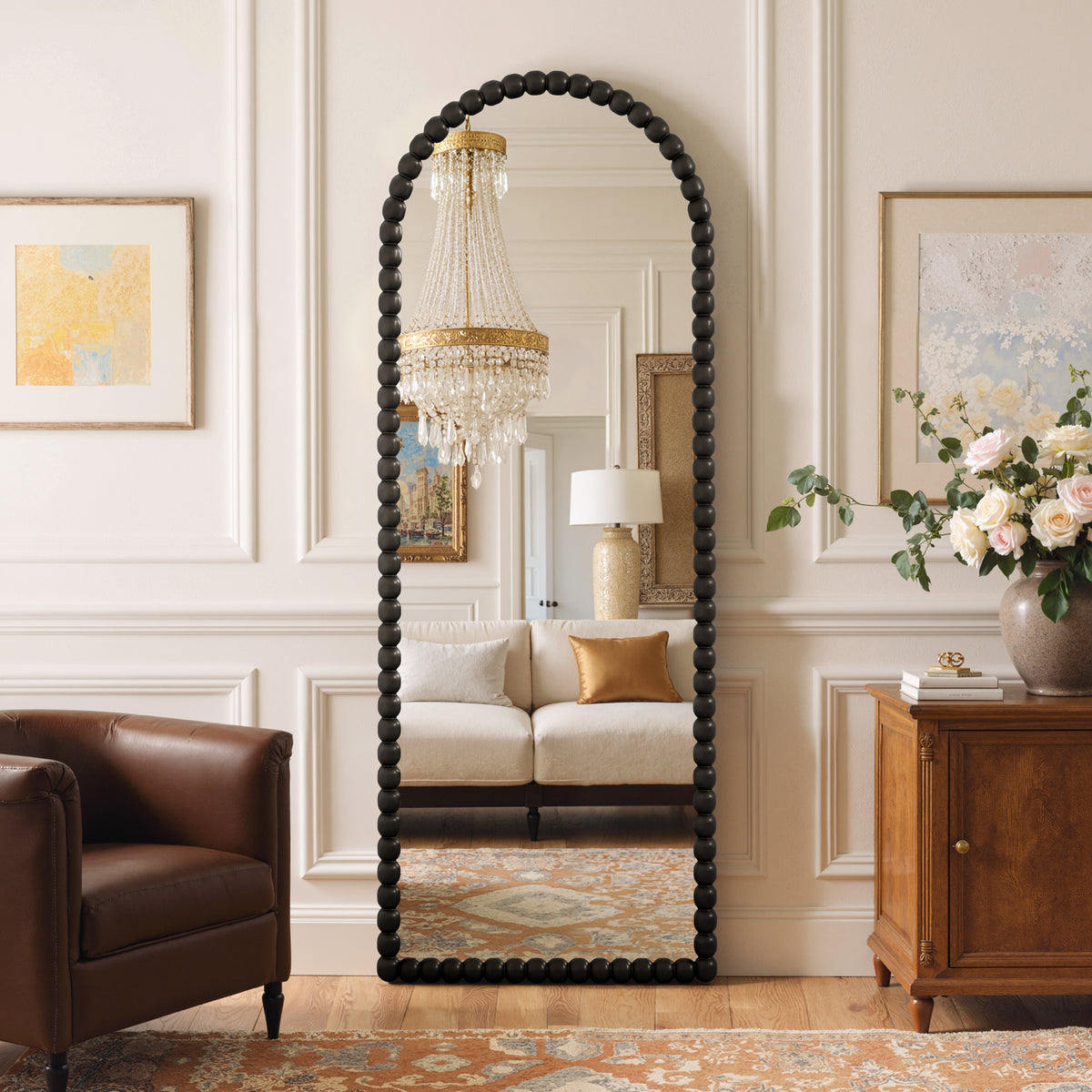 Delphine black beaded arched full-length mirror in a living room