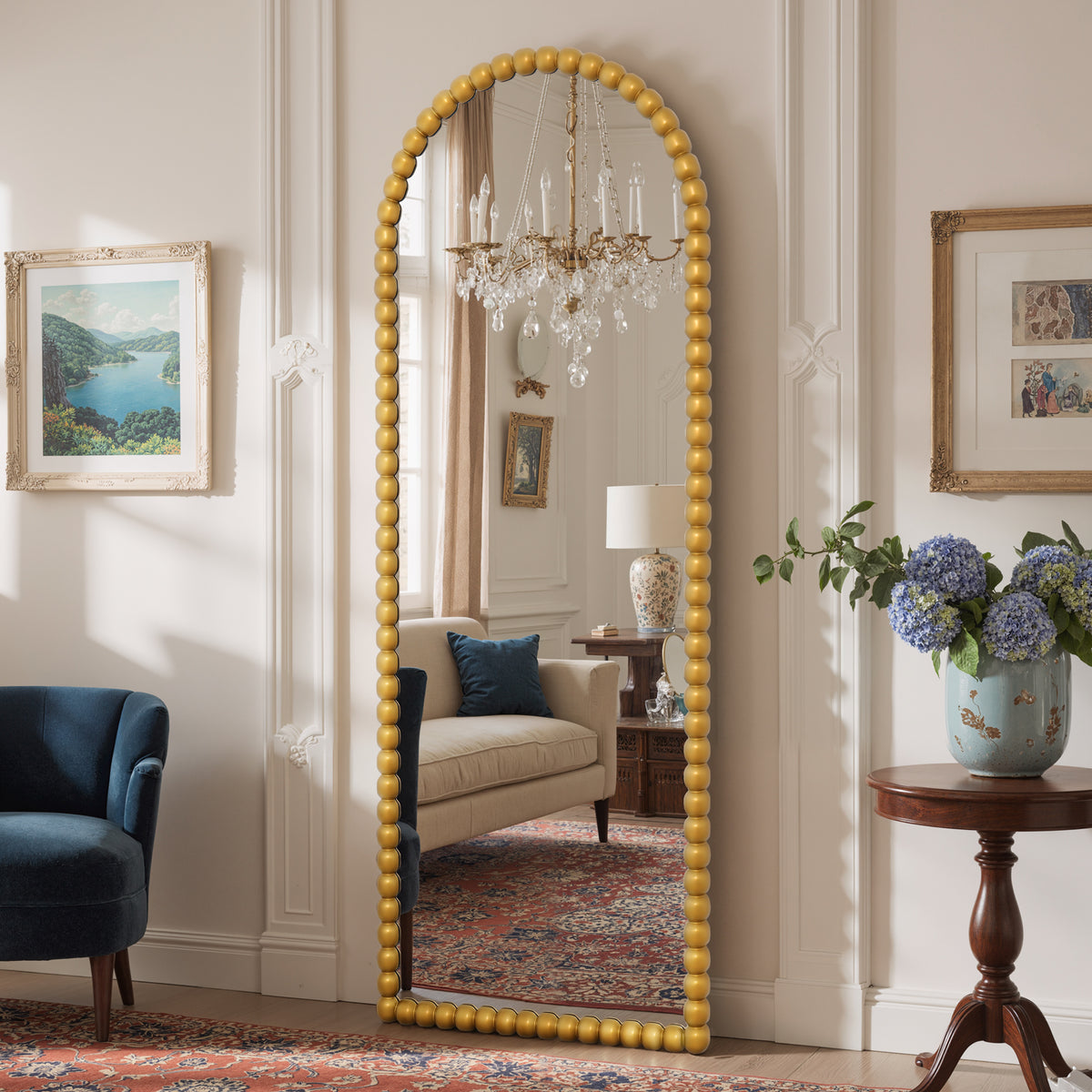 Delphine antique gold beaded arched mirror shown at an angle