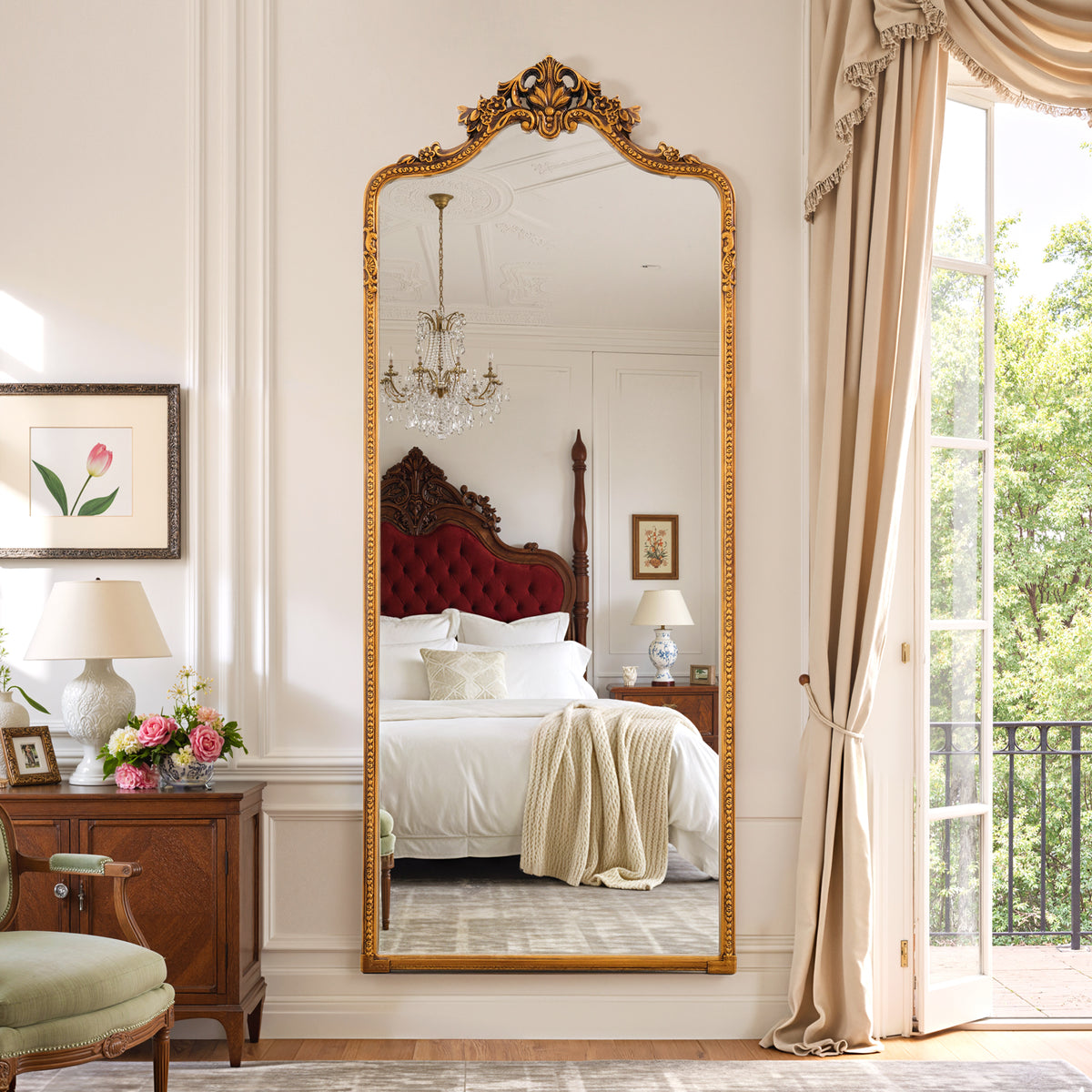 Vivienne antique gold floral crest full-length mirror in a bedroom