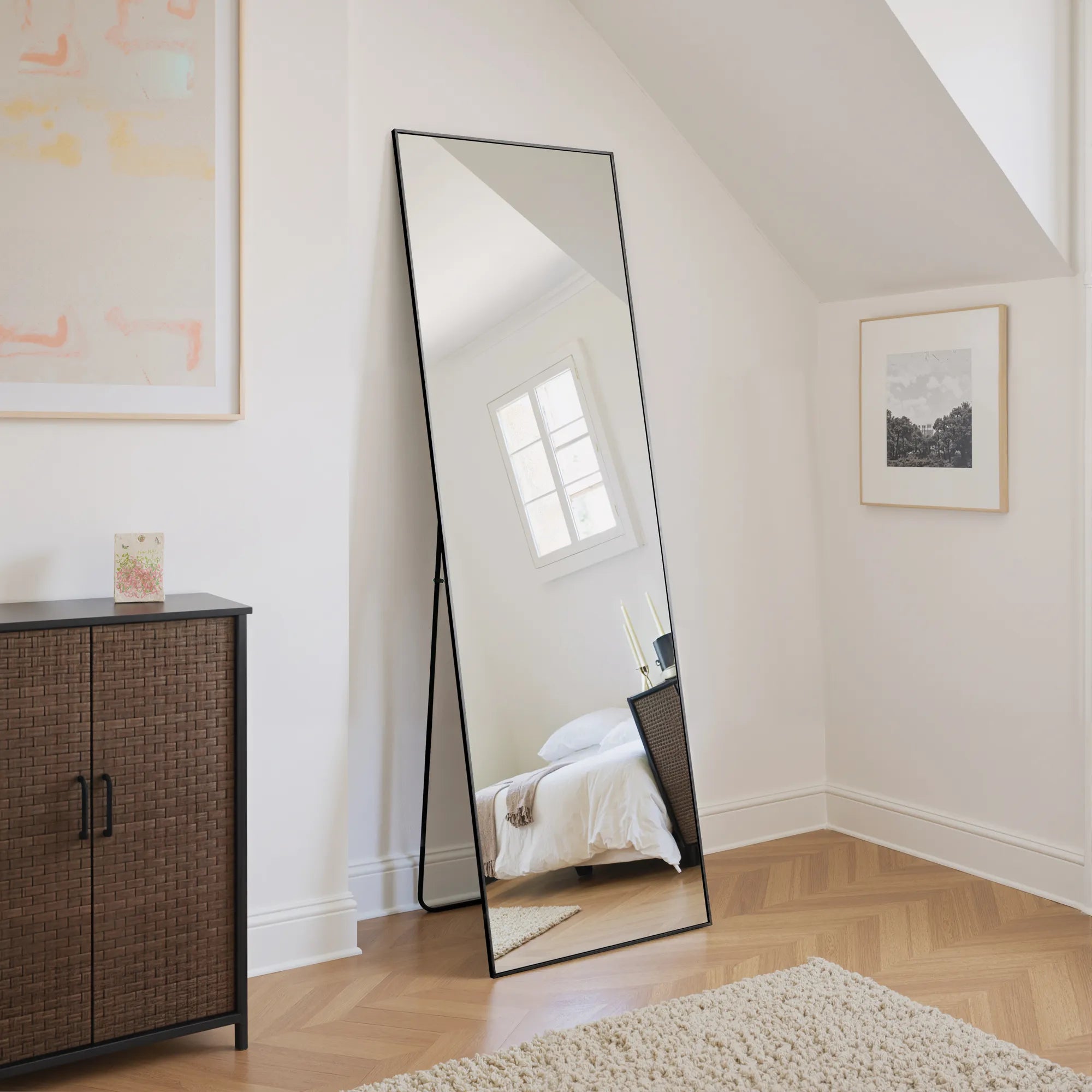 Jeffrey black rectangular full-length mirror standing in a bedroom