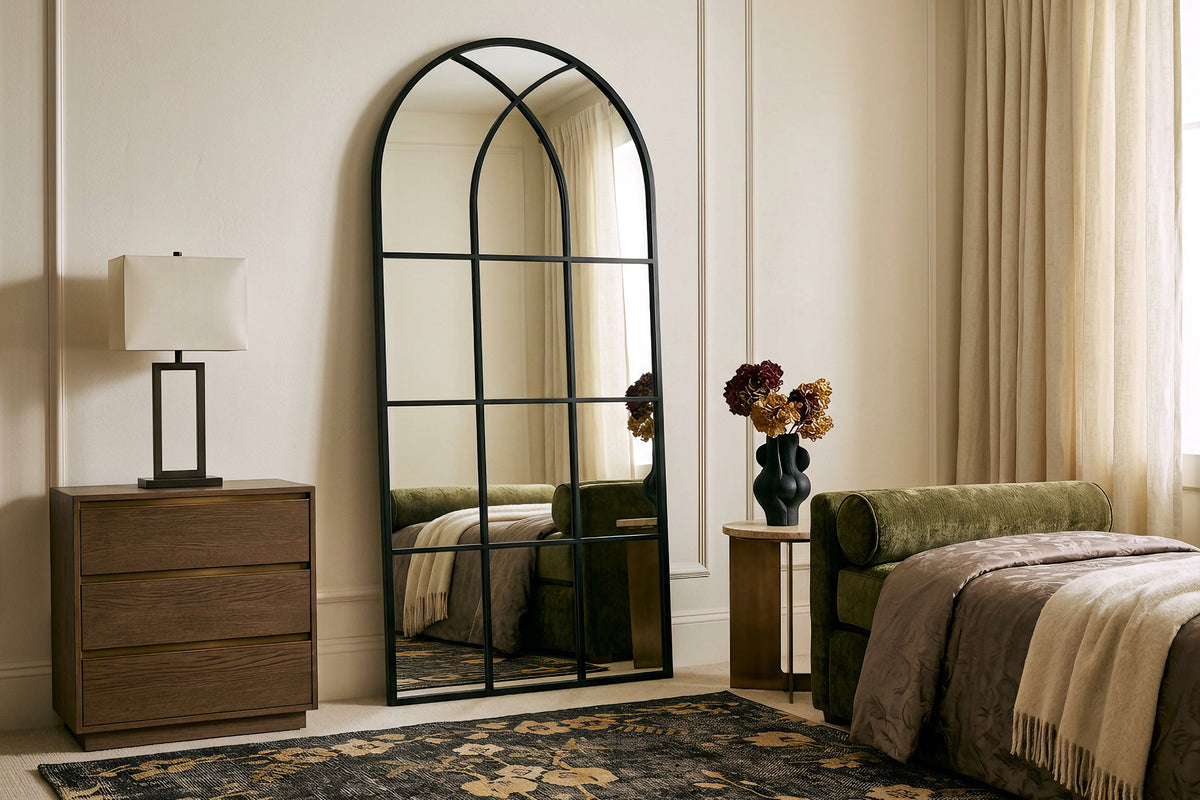 August black full-length windowpane mirror beside a bed
