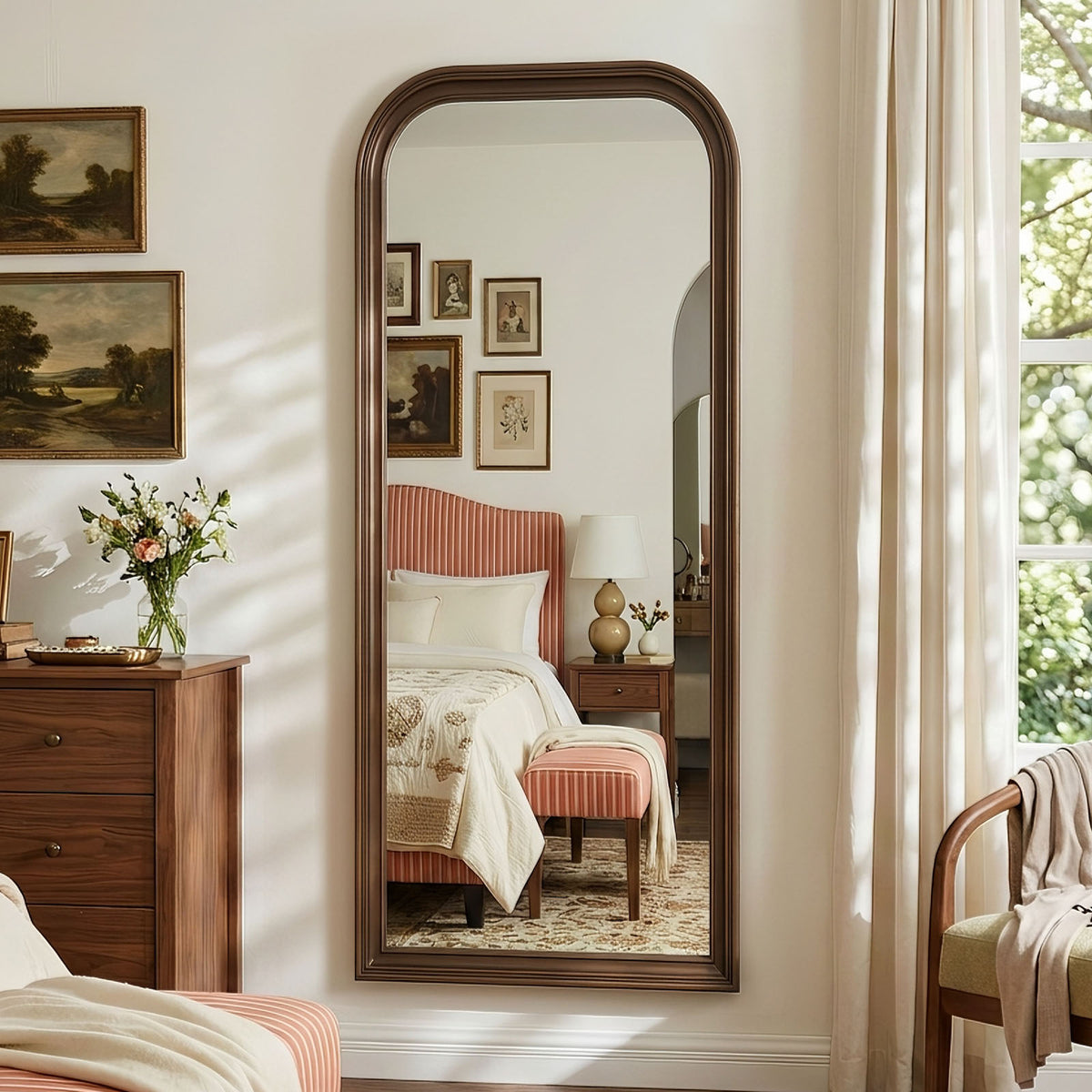 Estelle antique bronze full-length mirror mounted on a bedroom wall