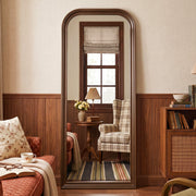 Estelle antique bronze full-length mirror in a living room
