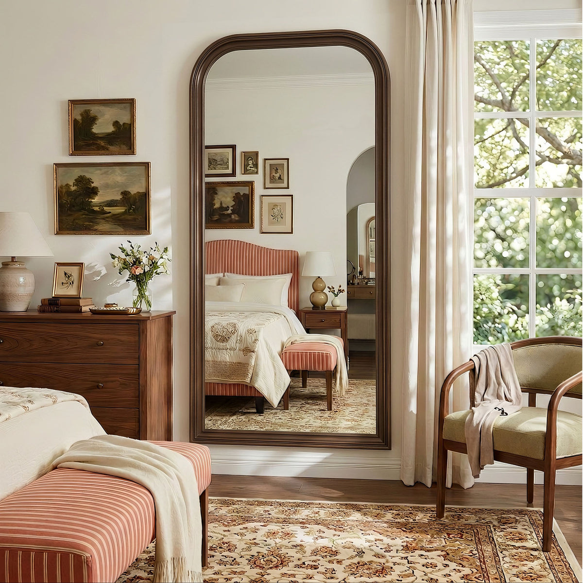 Estelle antique bronze full-length mirror mounted on a bedroom wall