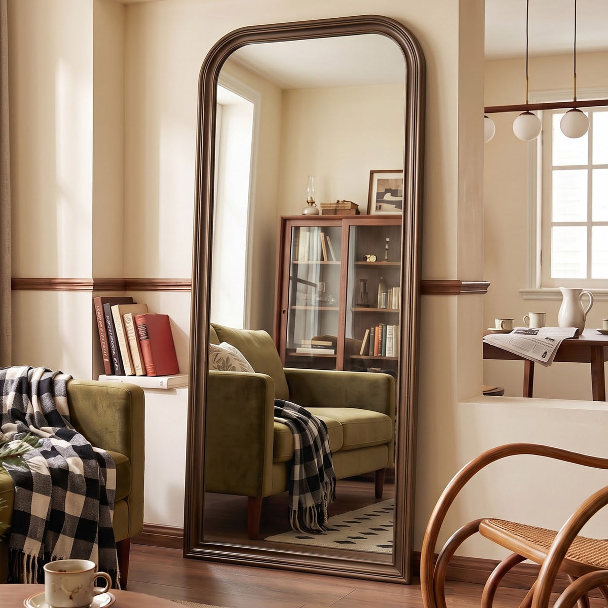 Estelle antique bronze full-length mirror in a furnished interior