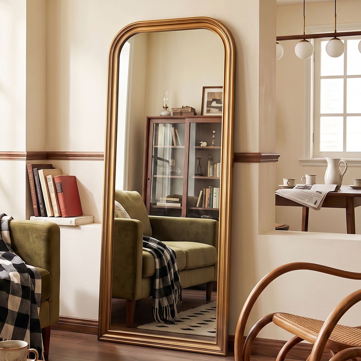 Estelle antique gold full-length mirror in a furnished interior