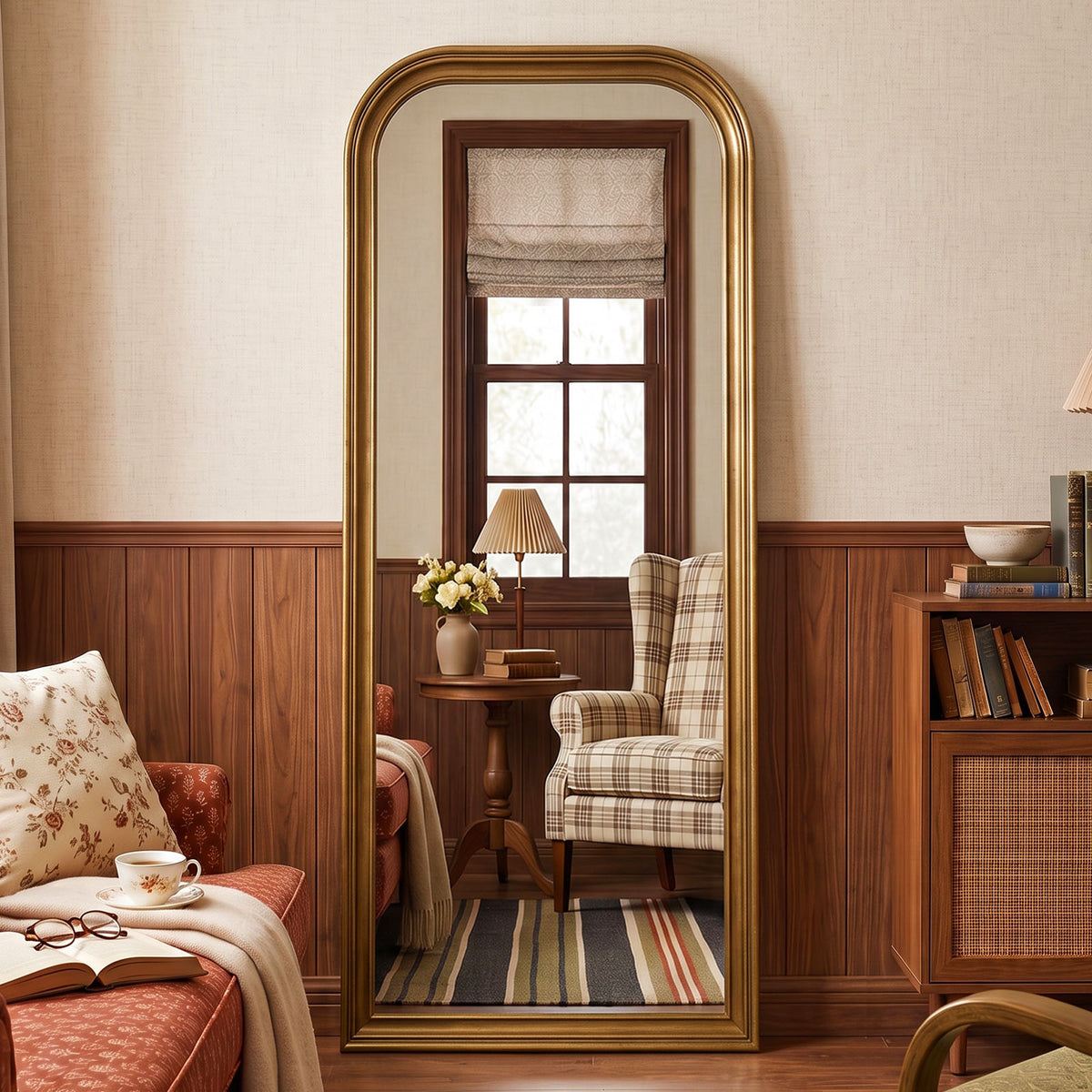 Estelle antique gold full-length mirror in a living room