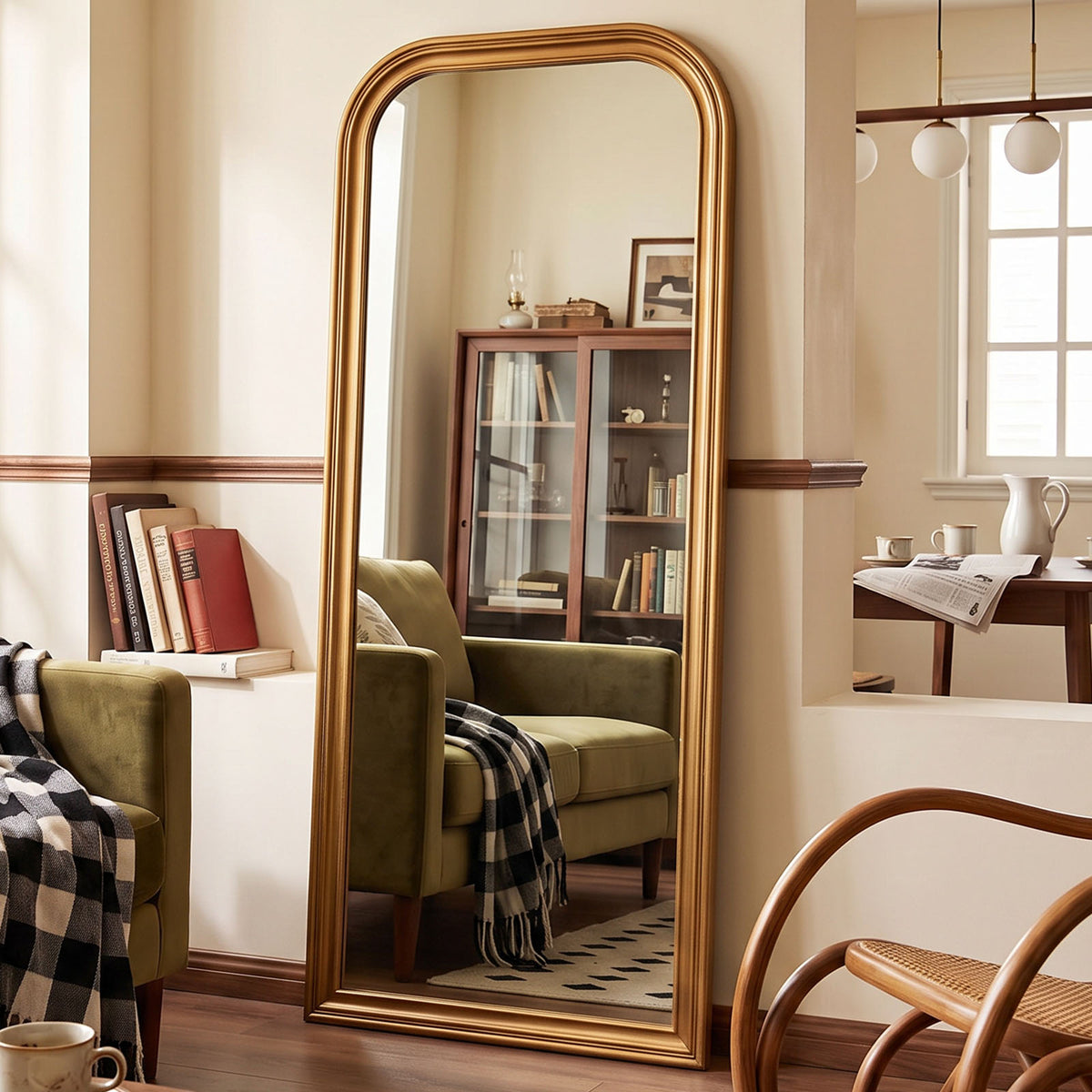 Estelle antique gold full-length mirror in a furnished interior