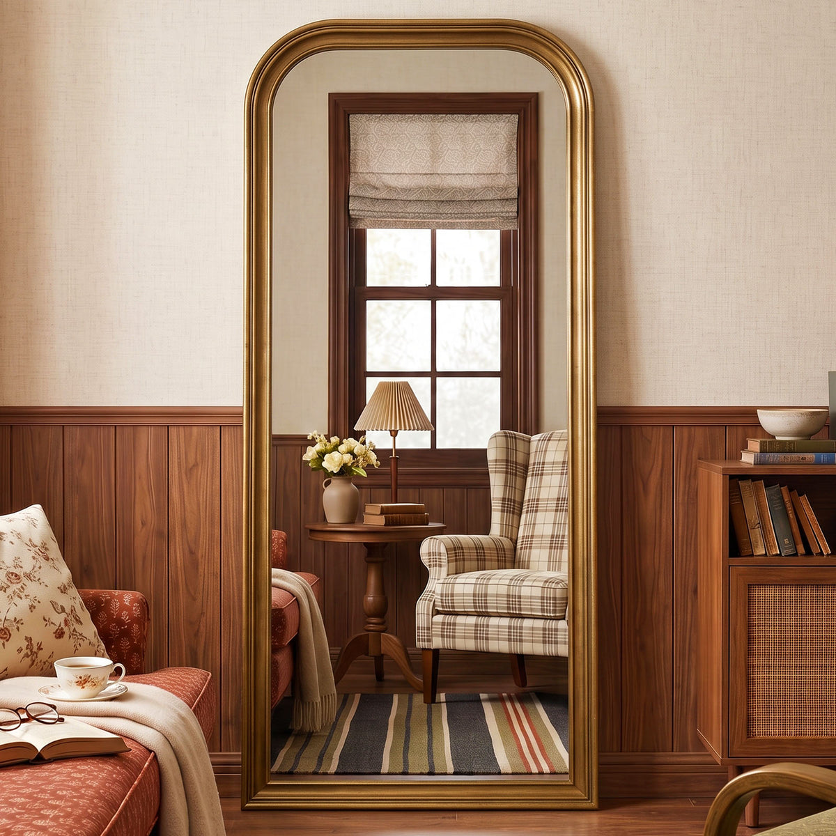 Estelle antique gold full-length mirror in a living room