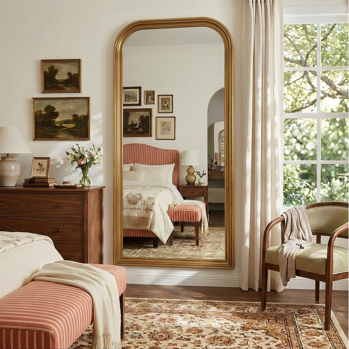 Estelle antique gold full-length mirror mounted on a bedroom wall
