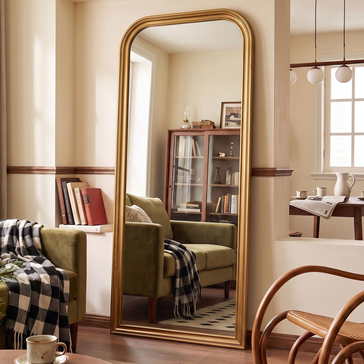 Estelle antique gold full-length mirror in a furnished interior