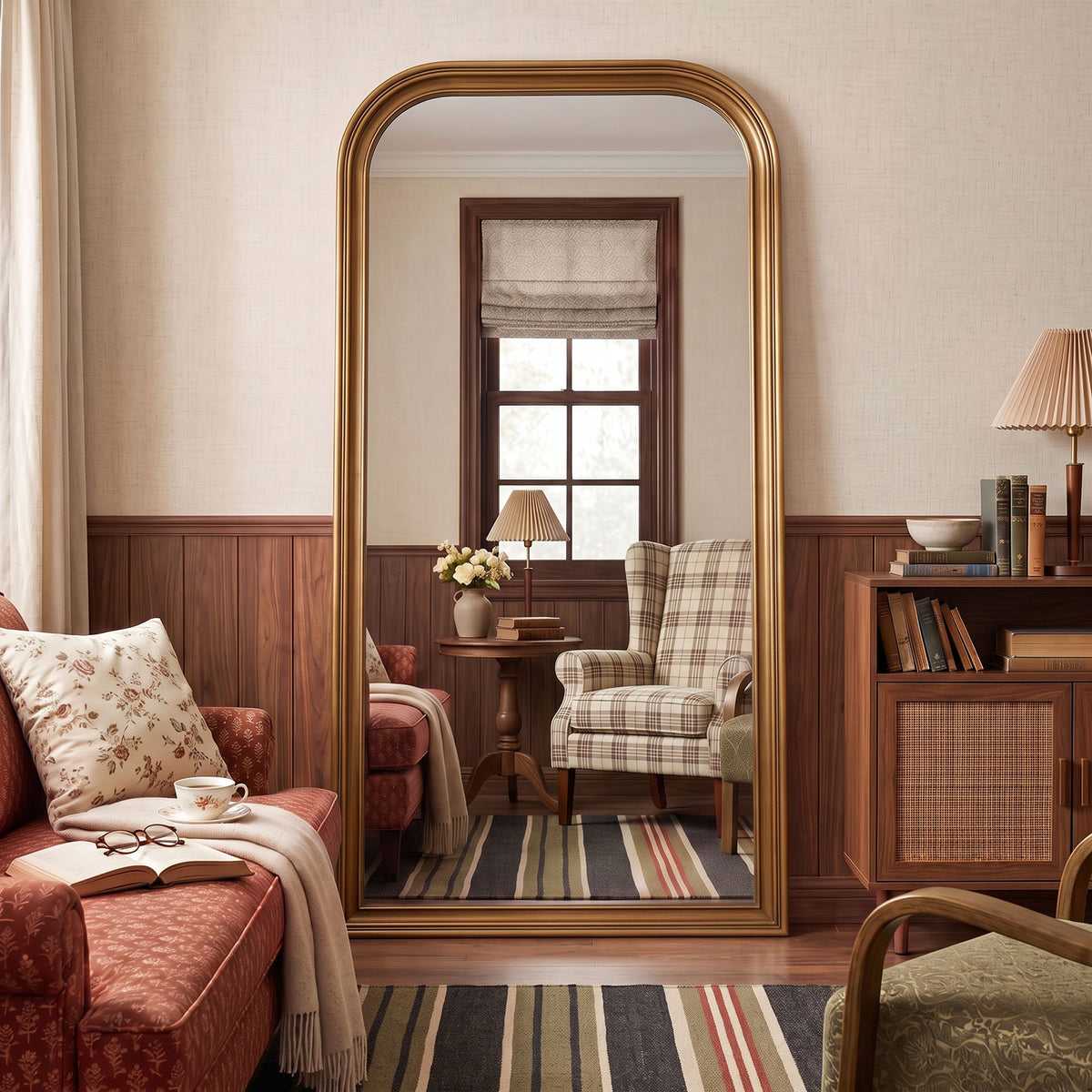 Estelle antique gold full-length mirror in a living room