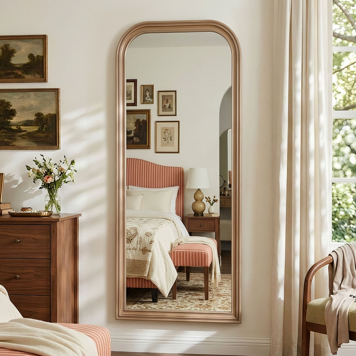 Estelle antique silver full-length mirror mounted on a bedroom wall