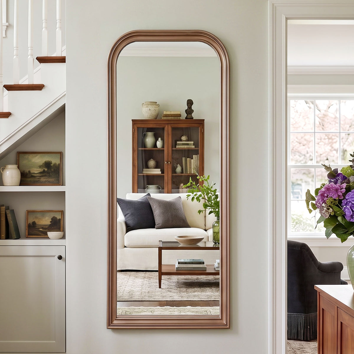 Estelle antique silver full-length mirror mounted beside a staircase