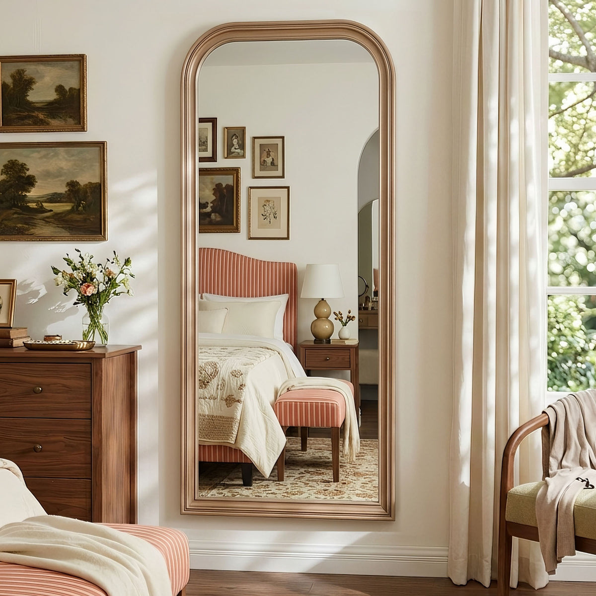 Estelle antique silver full-length mirror mounted on a bedroom wall