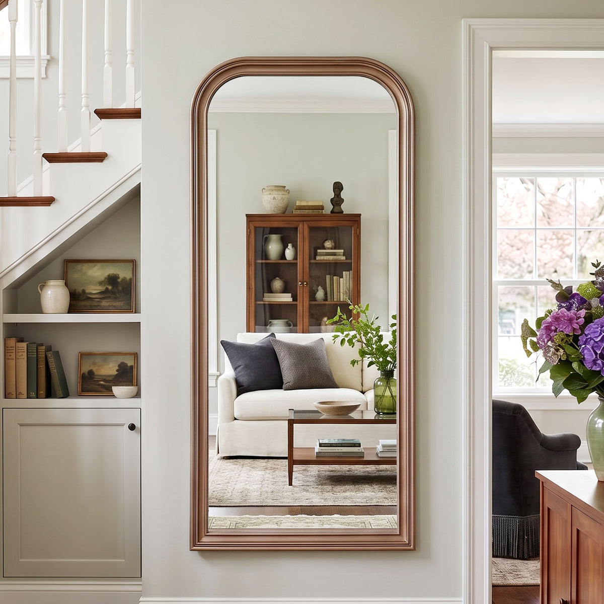 Estelle antique silver full-length mirror mounted beside a staircase