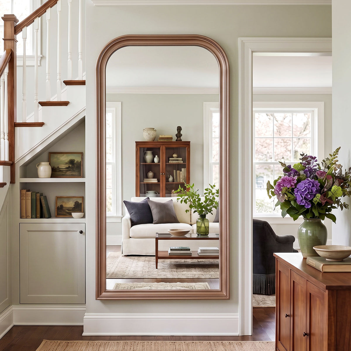 Estelle antique silver full-length mirror mounted beside a staircase