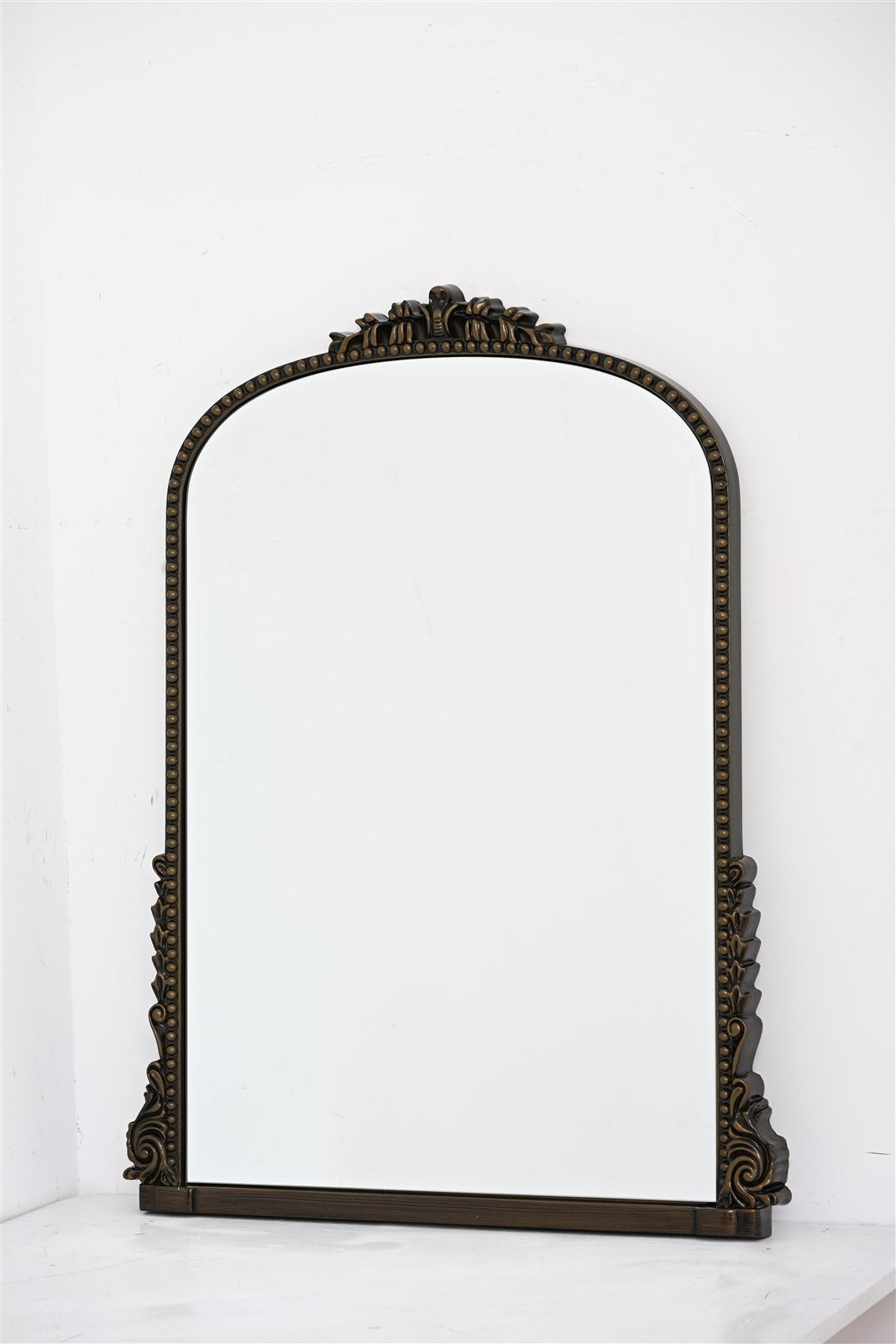 evelyn antique bronze mirror photographed from the front